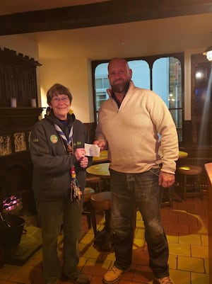 Chairman James Gittins hands cheque to Alice Pritchard from 8th Bridgnorth Scouts 