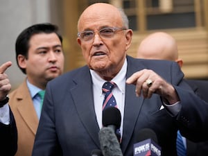 Rudy Giuliani speaks to reporters as he leaves the federal courthouse in New York