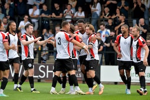 Hednesford Town players celebrate. 
