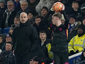 Chelsea manager Enzo Maresca, left, watches on from the touchline as Cole Palmer takes a throw-in