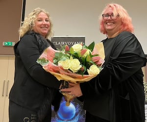 – Wyre Forest Cancer Research UK Fundraising Committee member Anita Rose presents flowers to medium Barbara Northall