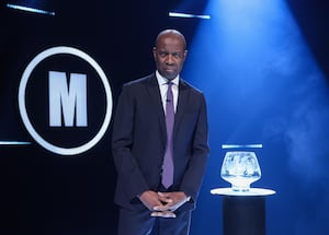 Clive Myrie with Mastermind Glass Bowl Trophy