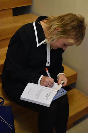 Yvonne signing copies of My Forever Best Friend at the launch