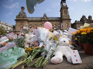 Flowers and tributes outside the Atkinson Art Centre Southport in tribute to the victims