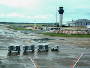 Baggage handlers on the runway at terminal one Manchester Airport