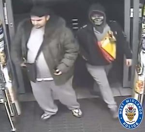 Police want to speak to this pair after an alleged armed robbery in Rowley Regis. Photo: West Midlands Police