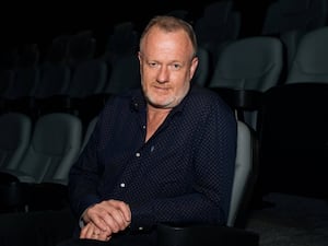 Handout photo of Tony Lankester sitting in an arts venue