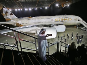 A man takes a selfie in front of a new Etihad Airways A380 in Abu Dhabi