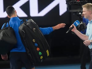 Novak Djokovic (left) declines to do a post-match interview with Jim Courier