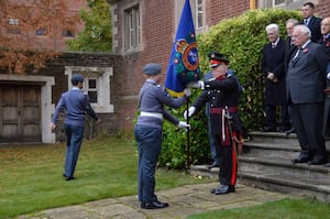 Student and Cadet Standard Bearer, Flight Sergeant Archie Payne receives the new OSH CCF banner