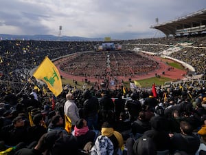 Mourners packed into the stadium