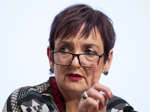 Headshot of Angela Constance, wearing glasses