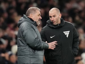 Ange Postecoglou (left) speaks to fourth official Tim Robinson