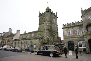 A hearse outside St Peter's Church in Shaftesbury, Dorset, during the funeral of DJ Johnnie Walker.                                                                                                                                