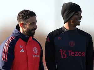 Marcus Rashford, right, smiles while stood next to Ruben Amorim