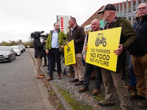 Farmers holding signs 'no farmers, no food, no future'