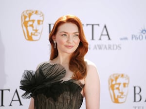 Eleanor Tomlinson smiling at the 2024 Baftas