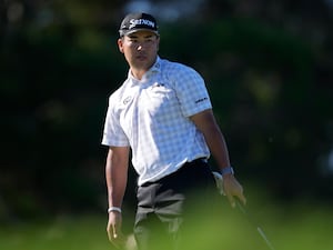 Hideki Matsuyama, of Japan, watches a missed putt at the third hole