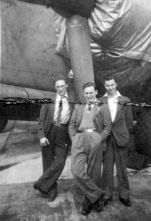 Cyril Plimmer, right, with fellow apprentices John Wiggins and Philip Wixon, next to a Wellington bomber in 1947