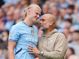 Manchester City’s Erling Haaland (left) alongside Pep Guardiola