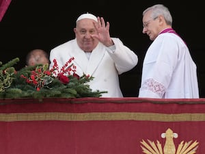 Pope Francis waves before delivering the Urbi et Orbi from the main balcony of St Peter’s Basilica at the Vatican