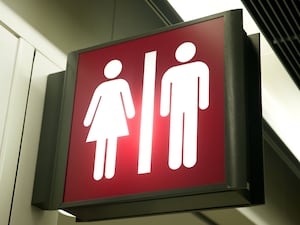 Sign showing male and female toilet symbols