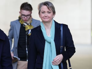 Yvette Cooper in blue scarf smiling at camera