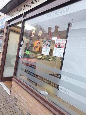 'Save Wollaston Village Loos' poster in Langs Butchers, Wollaston