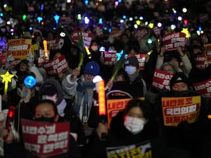 Participants gather to stage a rally demanding South Korean President Yoon Suk Yeol’s impeachment, in front of the headquarters of the ruling People Power Party in Seoul