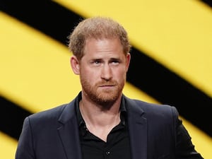 The Duke of Sussex in front of a yellow and black background