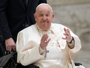 The Pope gestures to the faithful