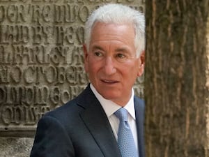 Charles Kushner looking backward over his shoulder