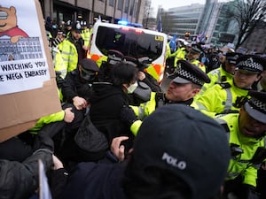 Police hold back protesters