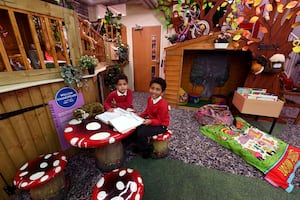 Lucas Humes, aged 6 and Fabian Treasure, aged 4, catching up on some reading at the library