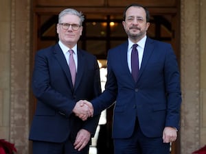 Sir Keir Starmer is welcomed by Cyprus’ President Nikos Christodoulides in Nicosia (Kirsty Wigglesworth/PA)