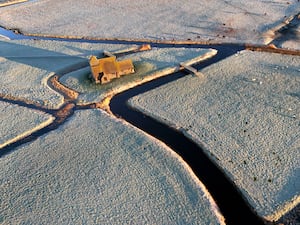 The St Thomas Becket church surrounded by frosty fields on the Romney Marsh in Kent on Friday morning