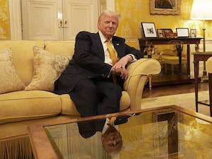 Donald Trump sitting on a settee