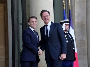 French President Emmanuel Macron greets Nato secretary general Mark Rutte