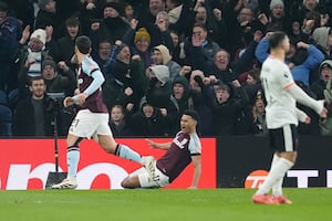 Aston Villa celebrates his goal against Liverpool