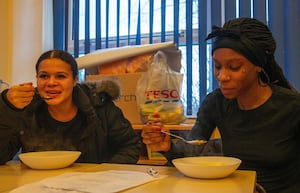 Pupils and parents who attended the workshop enjoying the food they created