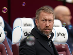 Graham Potter sits in the London Stadium dugout