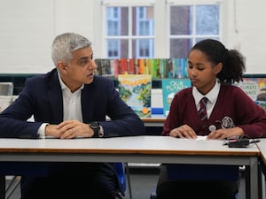 Sadiq Khan speaks to a pupil at school