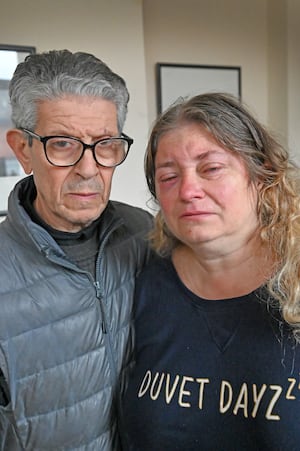 Diane Elcock, a 50-year-old schoolteacher who was helping behind the bar of the Trumpet, Bilston, was attacked on Sunday night. Pictured with her partner, Musti Bouameur.