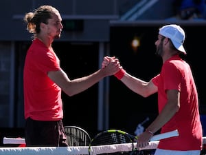 Jacob Fearnley, right, shakes hands with Alexander Zverev