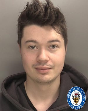 Alexander Westwood smirks in his mugshot