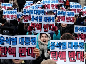 Supporters for impeached South Korean President Yoon Suk Yeol stage a rally against his impeachment near the Constitutional Court in Seoul, South Korea