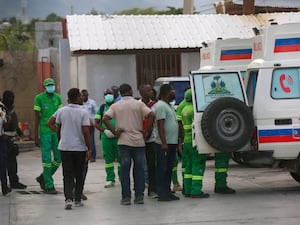 Medics surround an ambulance