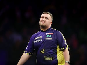 Luke Littler reacts during his match against Michael van Gerwen