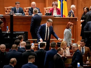 Marcel Ciolacu casts a vote at the parliament in Bucharest