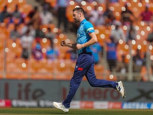 Mark Wood celebrates taking a wicket for England